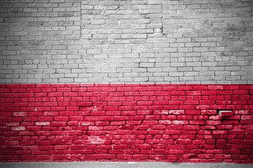 Ziegelsteinmauer mit Flagge Polen - obrazy, fototapety, plakaty