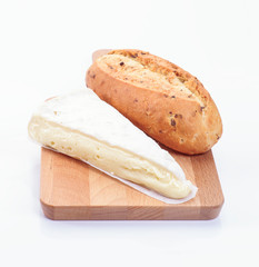 serving of creamy brie cheese and seed bread on table