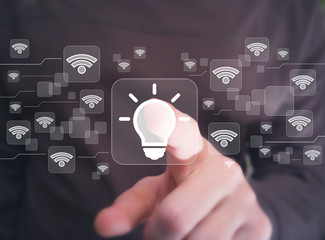 Social network WiFi businessman presses button idea bulb web