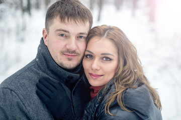 Fototapeta premium Portrait of happy couple in winter park