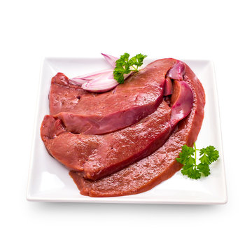 Three raw veal liver slices isolated, top view