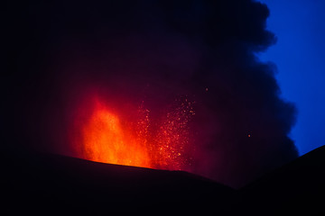 Fototapeta na wymiar Volcano eruption. Mount Etna erupting from the crater Voragine