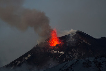 Volcano eruption. Mount Etna erupting from the crater Southeast

