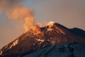 Volcano eruption. Mount Etna erupting from the crater Southeast
