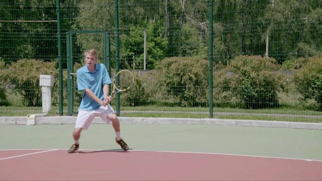 Two-Handed Backhand from the right court's coner. Powerfull tennis shot. Slow Motion