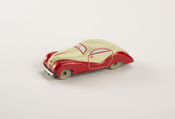 vintage tin car toy isolated on white