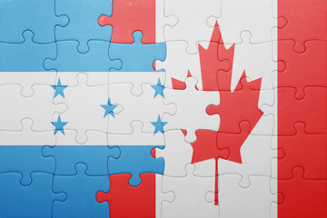 puzzle with the national flag of canada and honduras