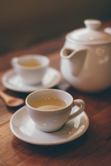 Obraz na płótnie Canvas cup of tea on the wood desk