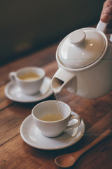 cup of tea on the wood desk