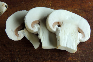 Fototapeta na wymiar mushroom on wooden background