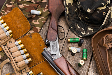 Hunter's bandolier bag on wooden background