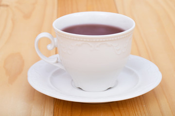 tea and macaroon on white