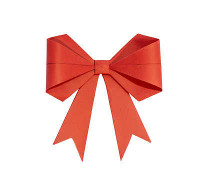 Red ribbon with bow made of paper on a white background