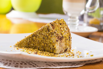 Slice of nut cake with chocolate cream