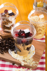 Creamy dessert in plastic cup