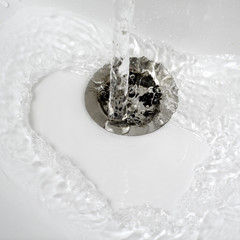 water flow into drain in bath