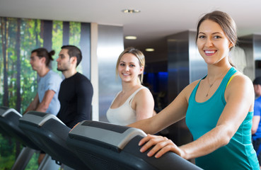 Fototapeta na wymiar Adults training on treadmills
