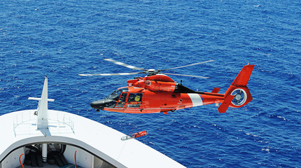 Rescue helicopter next to ship