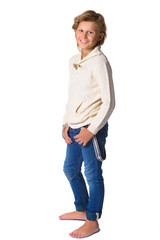 Fototapeta premium Cute blonde boy or teenager in full length casual style blue jeans posing isolated on white
