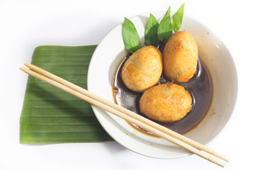 Stewed eggs on white background.