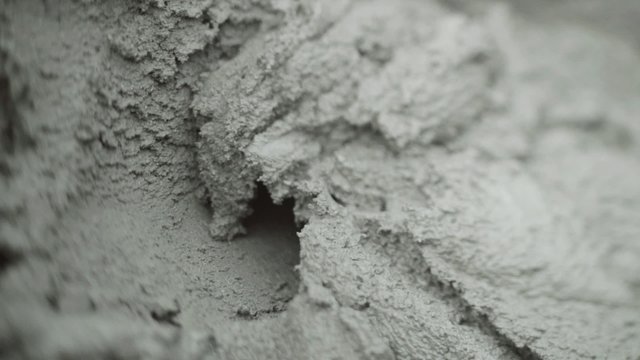 Spatula scooping the cement