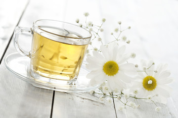 Cup of tea with chamomile flower