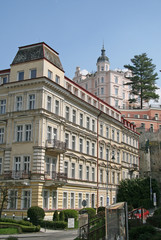 Fototapeta premium KARLOVY VARY, CZECH REPUBLIC - APRIL 20, 2010: Buildings in Karlovy Vary or Carlsbad that is a spa town situated in western Bohemia, Czech Republic