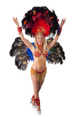 Happy carnival dancer posing with hands raised.