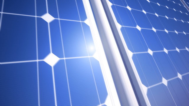 Loopable animation of endless solar energy panels arrangement at blue sky. HD