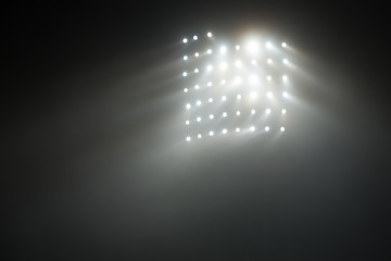 Obraz premium Bright white and yellow Stadium lights with fog
