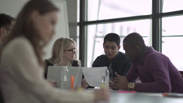 Group of attractive professionals involved in meeting