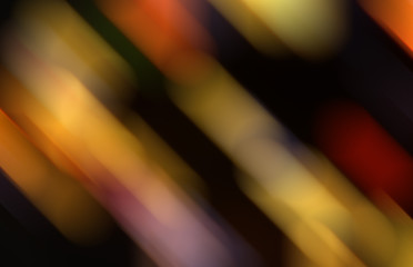 abstract background with yellow, purple and orange blurred shapes on the black