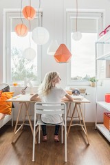 Schoolgirl studying in her room