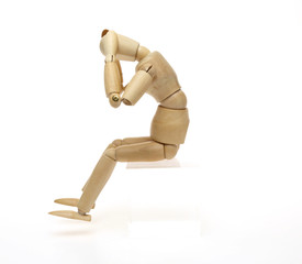 頭を抱えるポーズをする人形