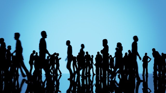 Silhouettes of a crowd of people. Big city life. Slowly moving camera position.