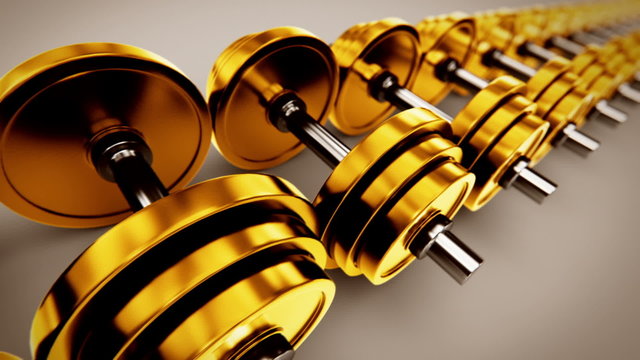 Animation of golden dumbbells. 3D view of weightlifting equipment. Loopable. HD