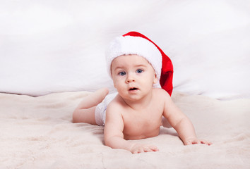 Beautiful little baby celebrates Christmas.