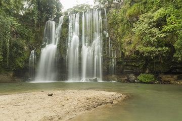 Fototapeta premium Silky Llanos de Cortés waterfall and Beach