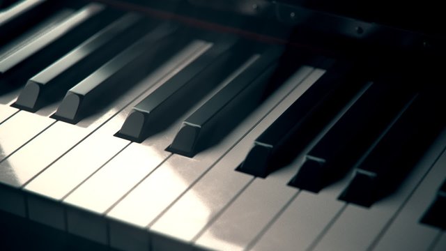 Black and white piano keys in close up. Beautiful glossy, antique instrument. 4K