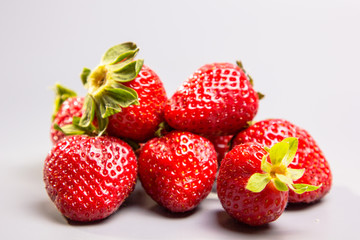 A few berries fresh strawberries on a gray background, Not in is