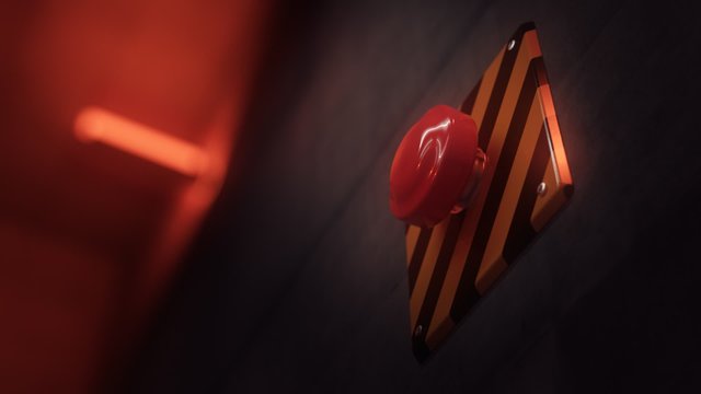 Close up of a big red vintage button during a dangerous emergency situation.