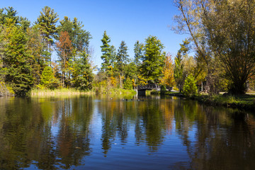 Fototapeta na wymiar Fall Colors on Scenic Pond in Ontario