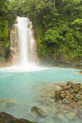Fototapeta na wymiar Rio Celeste Waterfall and Sulphurous Rocks