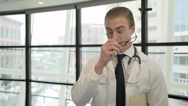 Attractive medical professional in doctors coat