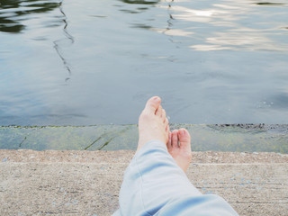 barefoot beside the river in the relaxing time
