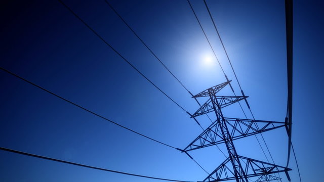 Endless electric powerlines and pylons loopable animation on a navy blue sky. HD