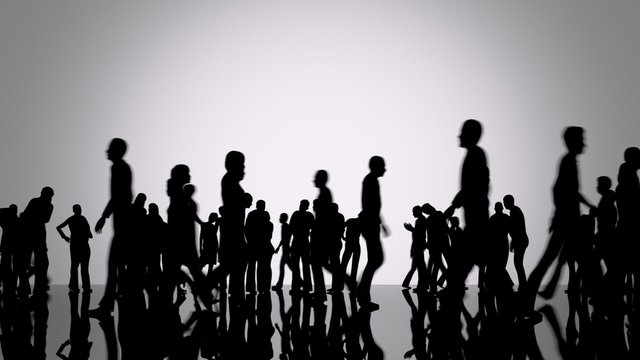 Silhouettes of a crowd of people. Big city life. Slowly moving camera position.