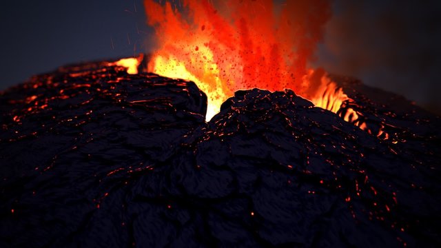 Active volcano eruption. Volcanic crater throws away glowy orange fireballs