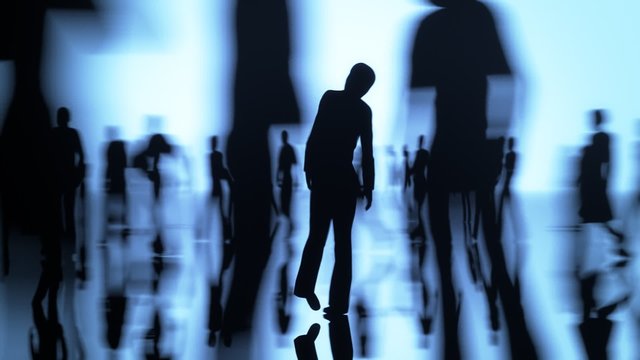 Focus on silhouette of alone woman in the crowd of people. Blue background.