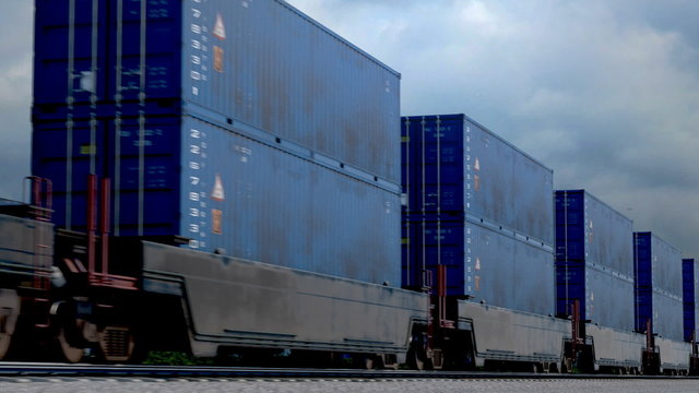 Freight train with stacked blue shipping containers on railway track
